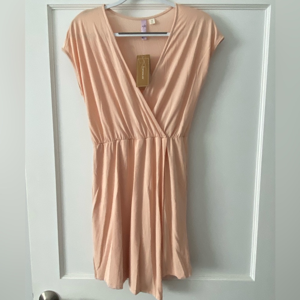 Francesca’s fit and flare peach midi dress